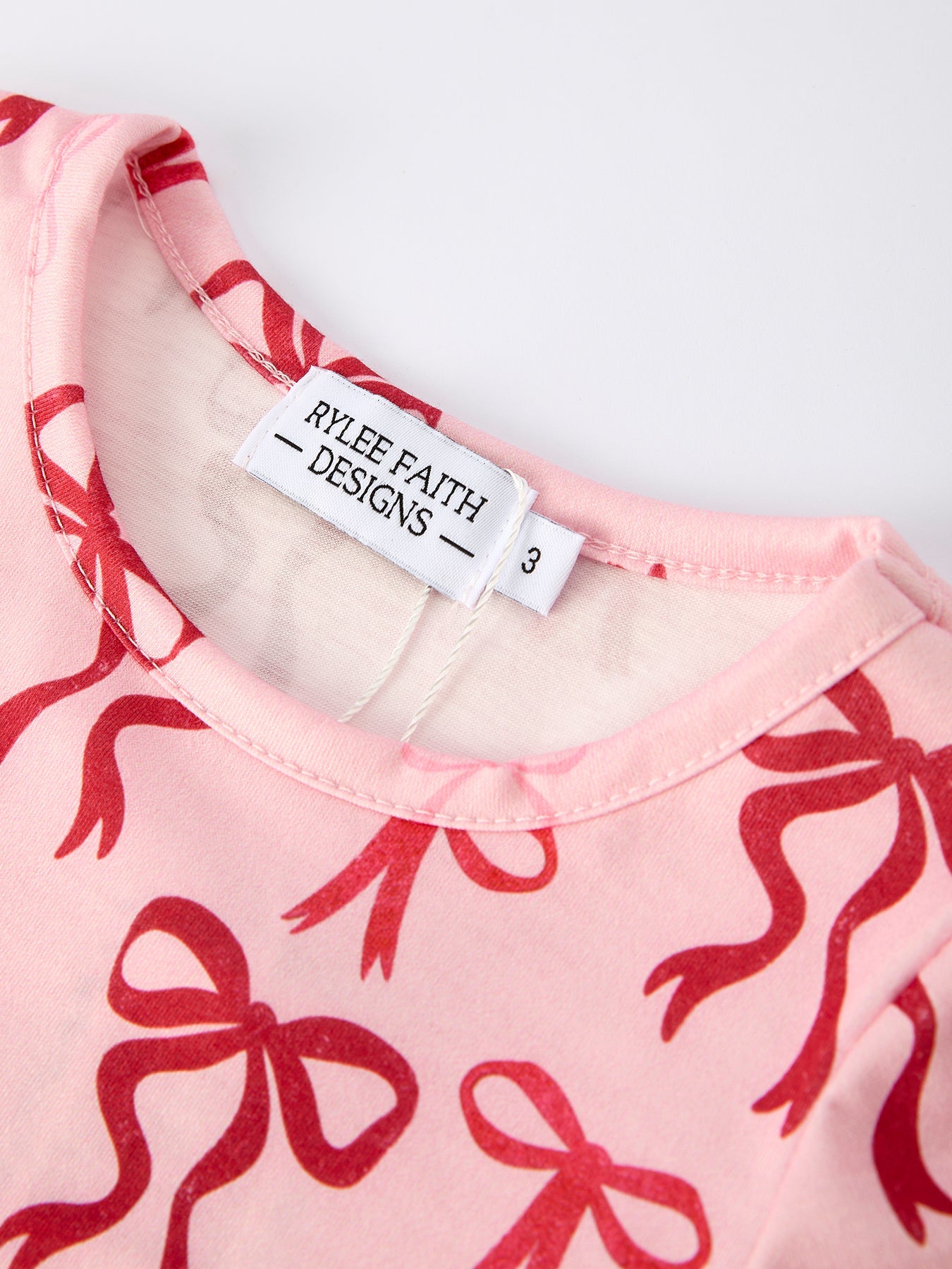 Pink Bow Print Girls Dress with Ruffle Hem