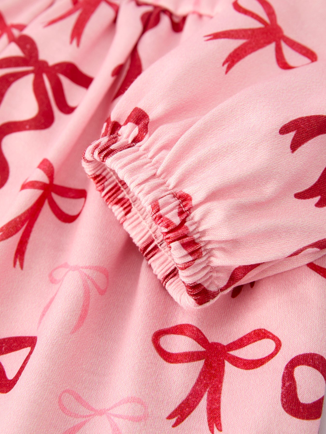 Pink Bow Print Girls Dress with Ruffle Hem