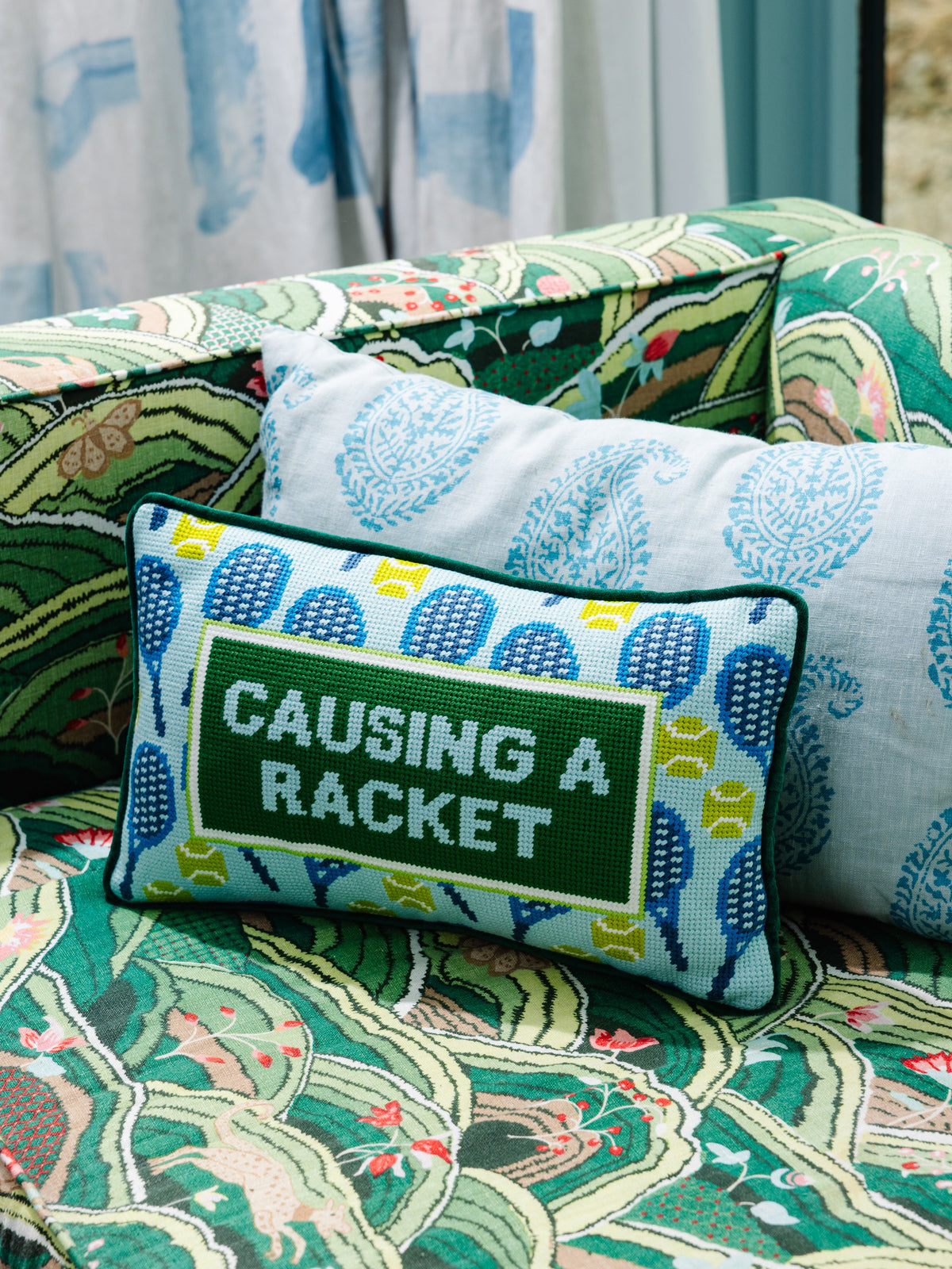 Causing A Racket Needlepoint Pillow