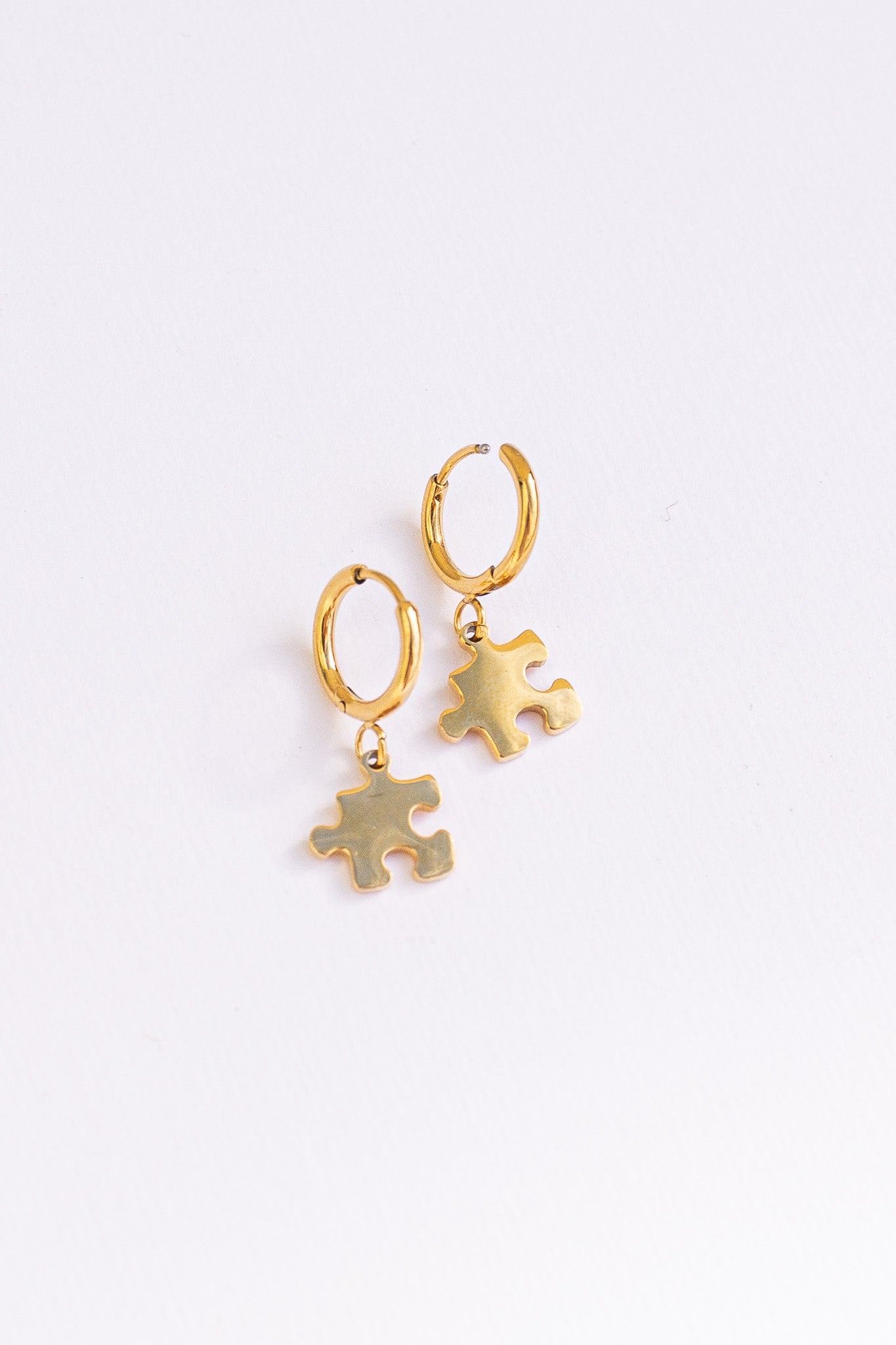 Puzzle Piece Huggie Hoops