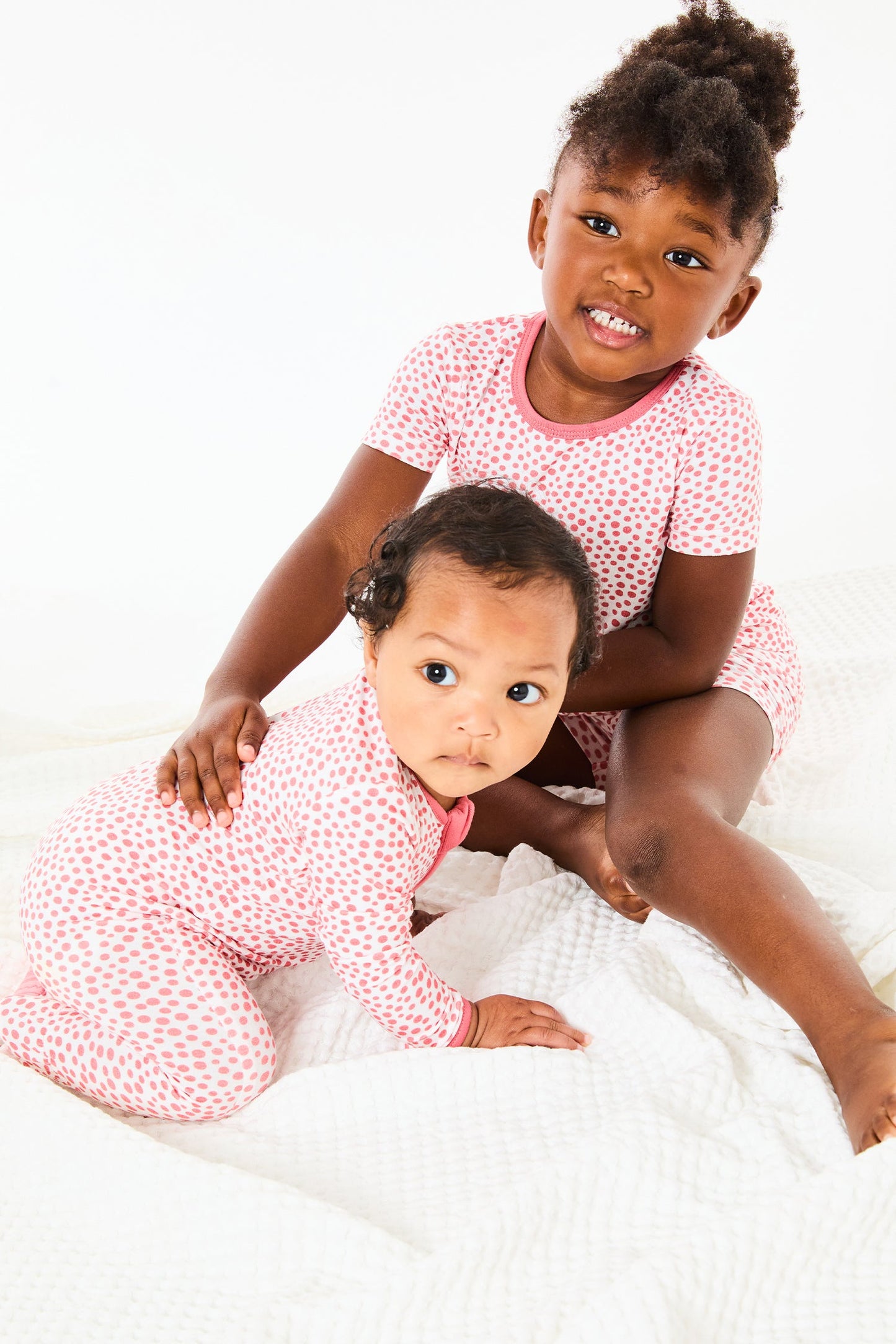 Soft & Stretchy Zipper Footie - Coral Dots