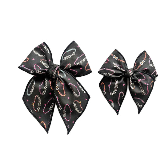 Friendship Bracelet on Black Elle Bow 