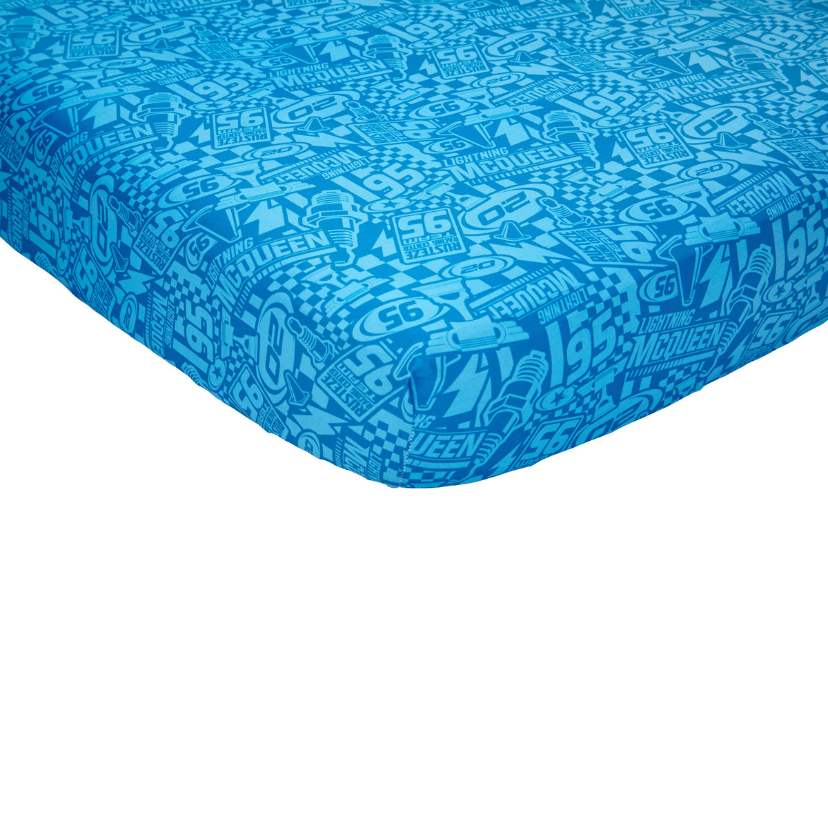 Disney Cars Rusteze Racing Team Blue, Red , and Yellow Amigo Cruz Ramirez and Jackson Storm 4 Piece Toddler Bed Set - Comforter, Fitted Bottom Sheet, Flat Top Sheet, and Reversible Pillowcase
