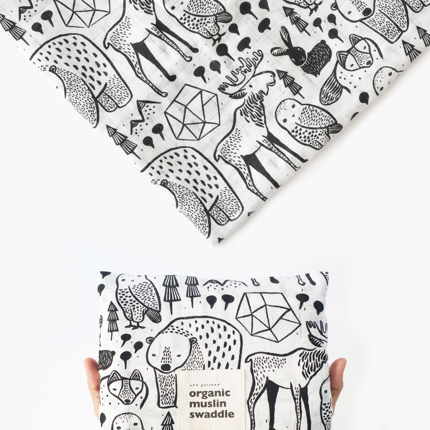 Black and white patterned organic muslin swaddle fabric with animal designs.