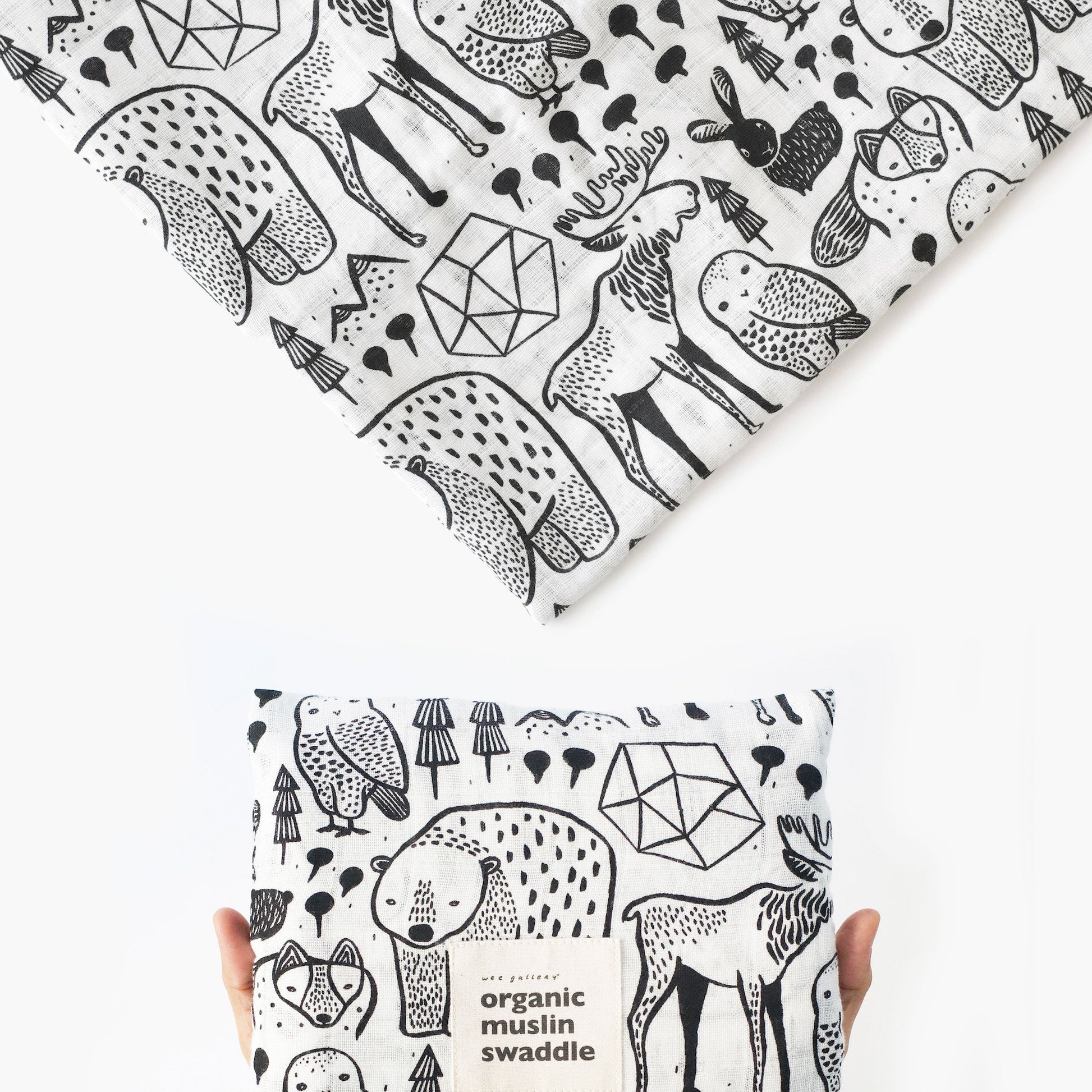 Black and white patterned organic muslin swaddle fabric with animal designs.